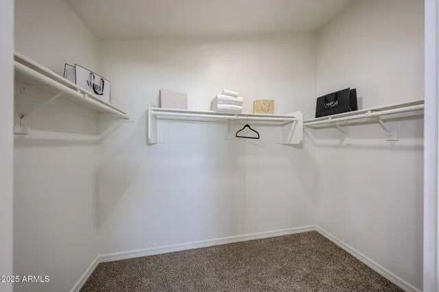 a bathroom with a double vanity sink toilet mirror and bathtub