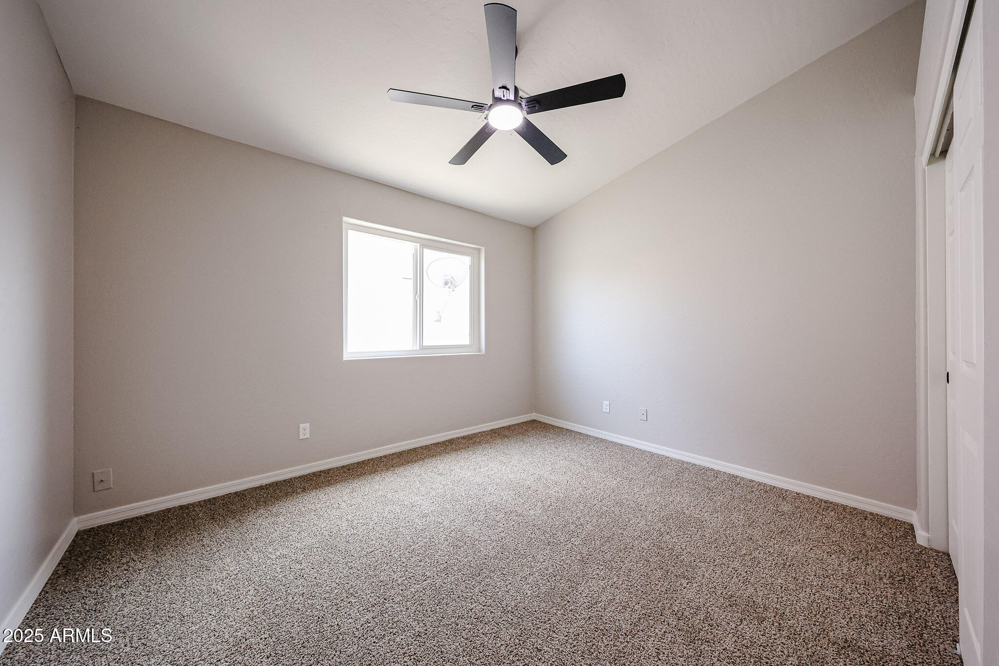 10334 East Diamond Avenue Mesa, AZ 85208 - Photo 23 of 39 an empty room with a window and a fan