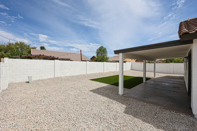 a view of house with yard and entertaining space