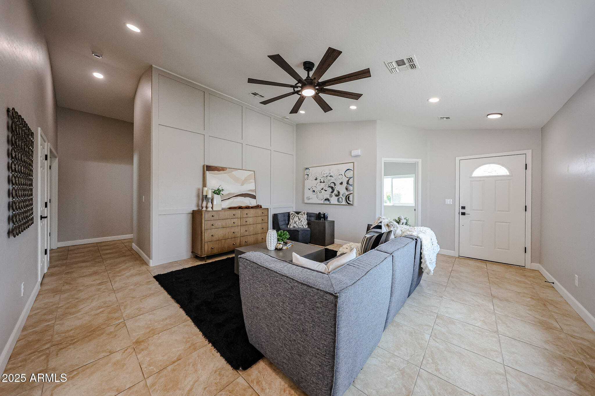 10334 East Diamond Avenue Mesa, AZ 85208 - Photo 3 of 39 a room with furniture a ceiling fan and a rug