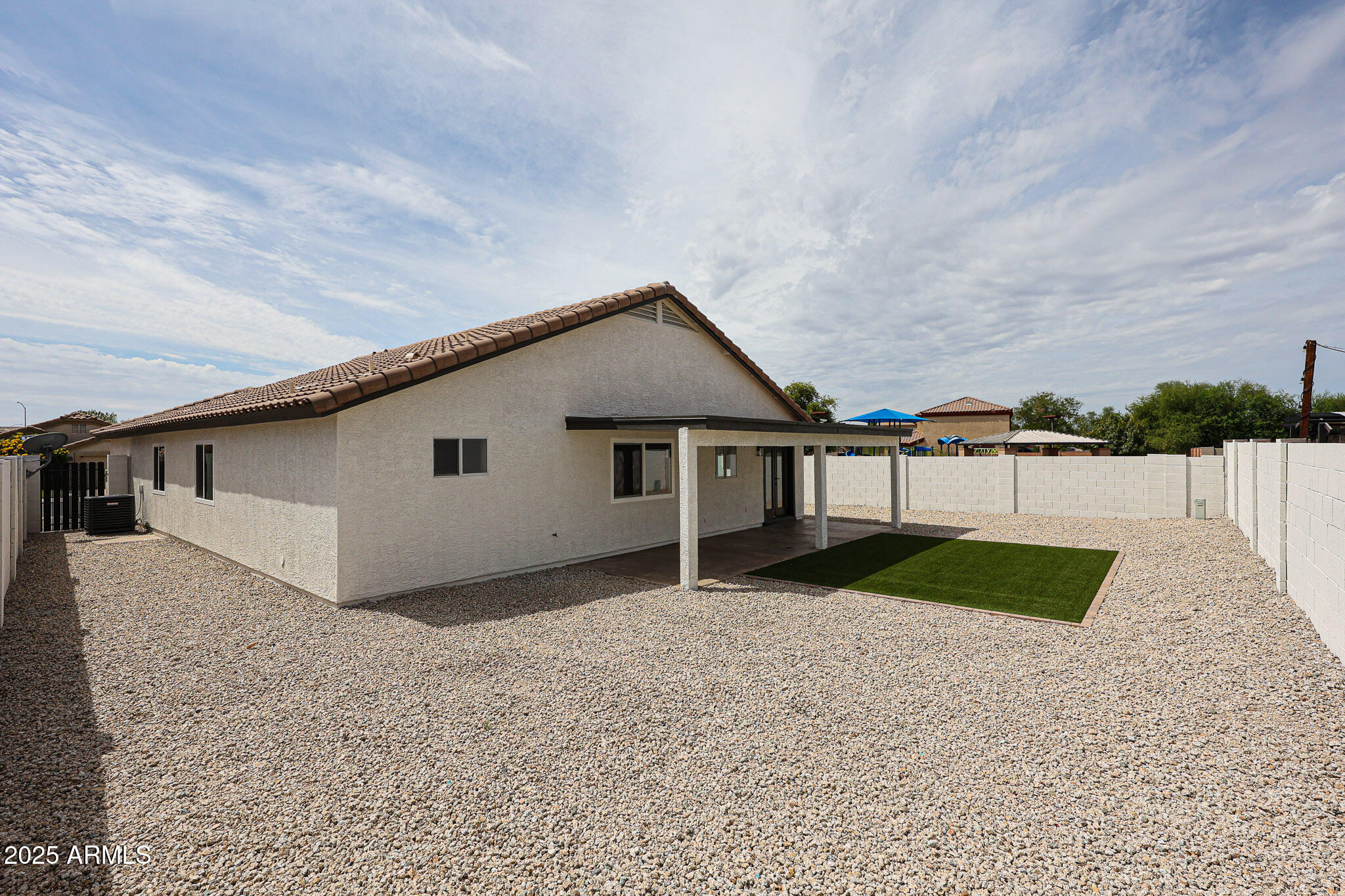 10334 East Diamond Avenue Mesa, AZ 85208 - Photo 32 of 39 a view of a house with a yard and fence