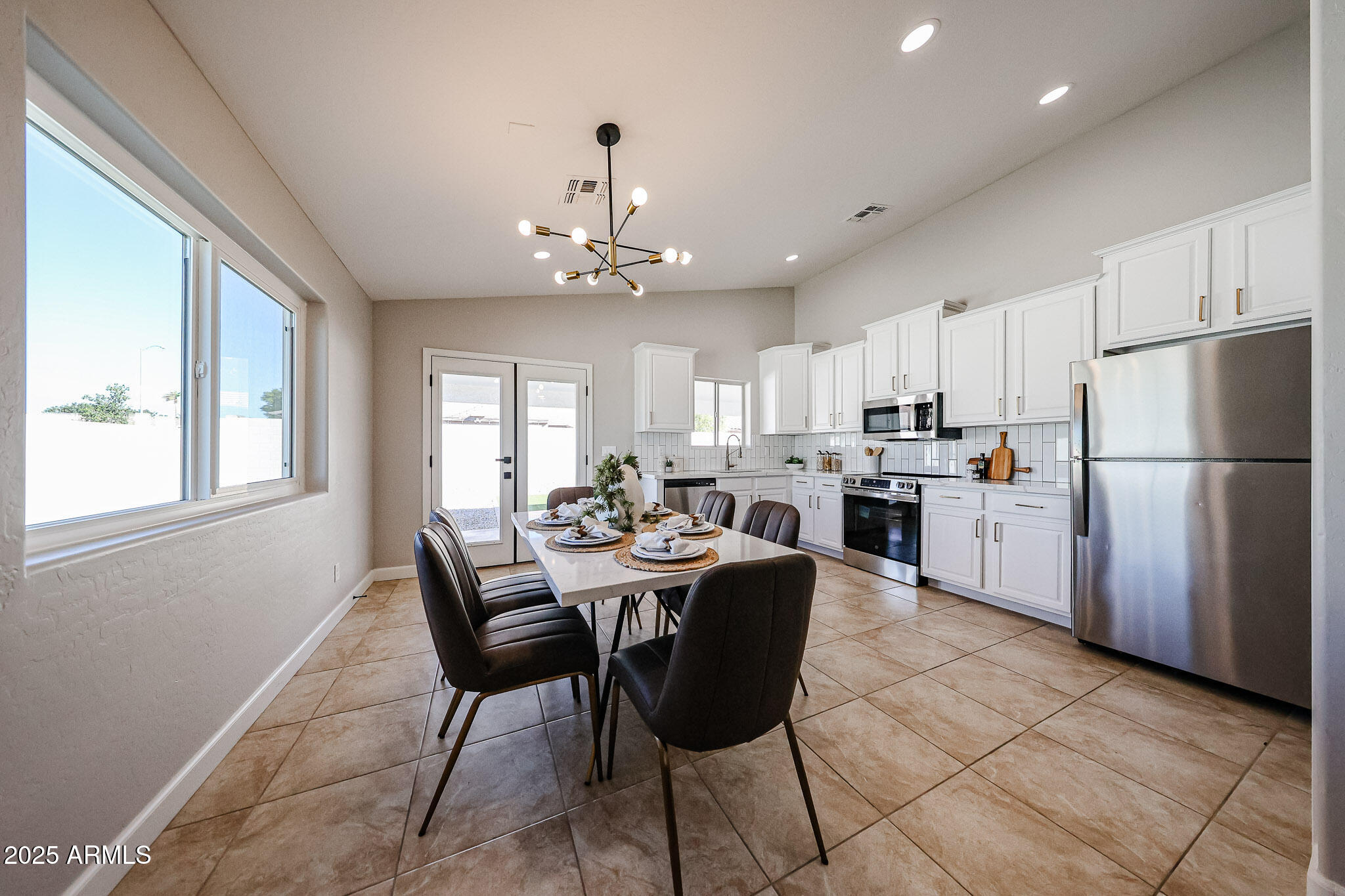10334 East Diamond Avenue Mesa, AZ 85208 - Photo 6 of 39 a view of kitchen with refrigerator dining table and chairs