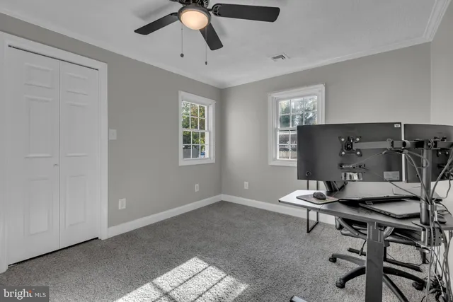 a workspace with furniture and window