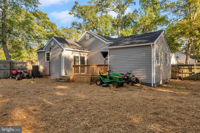 a view of a house with a yard and a garage