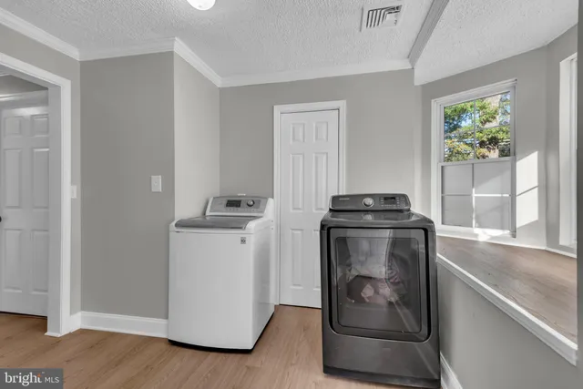 a utility room with washer and dryer