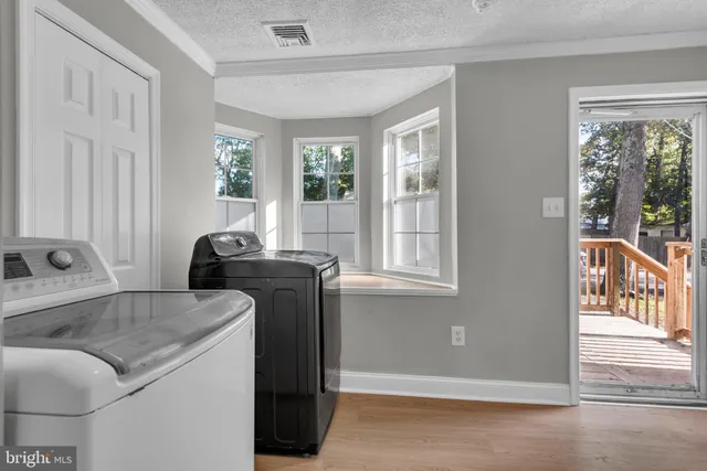 a living room with furniture and windows
