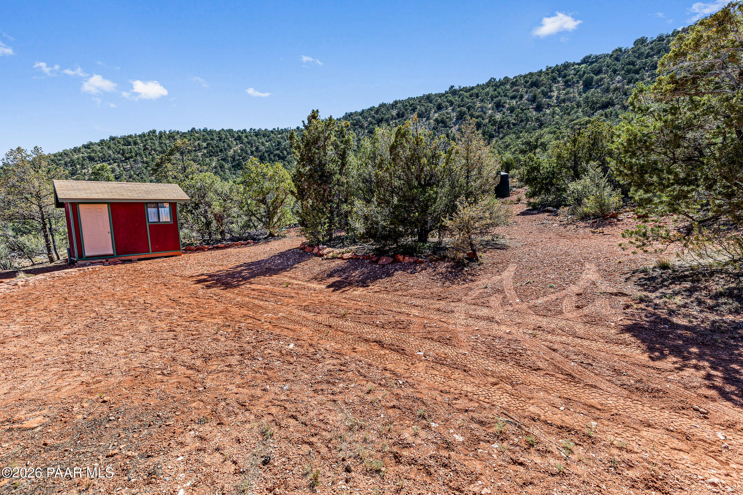 33749 West Whiskey River Road, Unit 21 Seligman, AZ 86337 - Photo 31 of 41 a view of an outdoor space and a yard