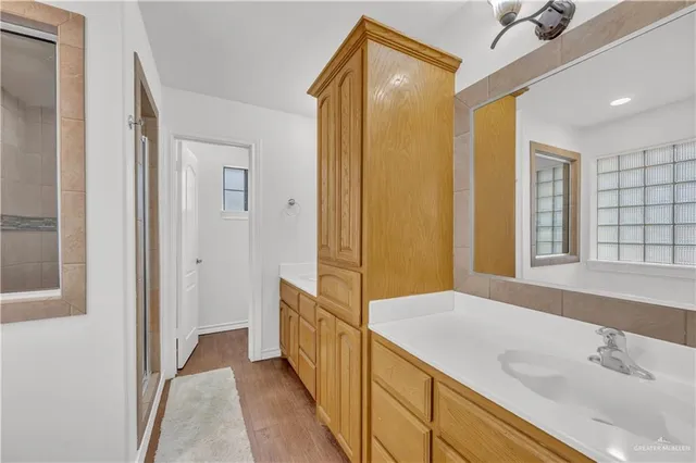 a bathroom with a sink and a mirror