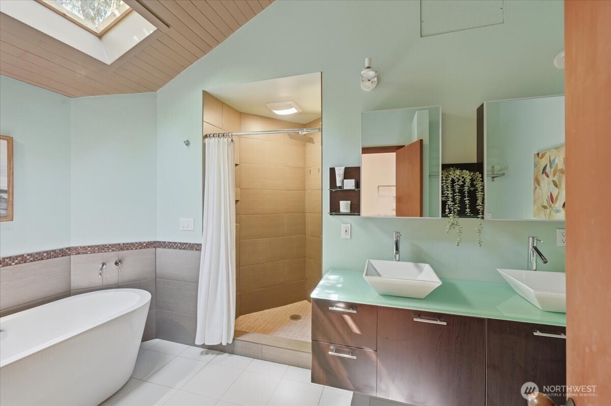 9418 Odin Way Bothell, WA 98011 - Photo 22 of 39 a bathroom with a sink a toilet and shower