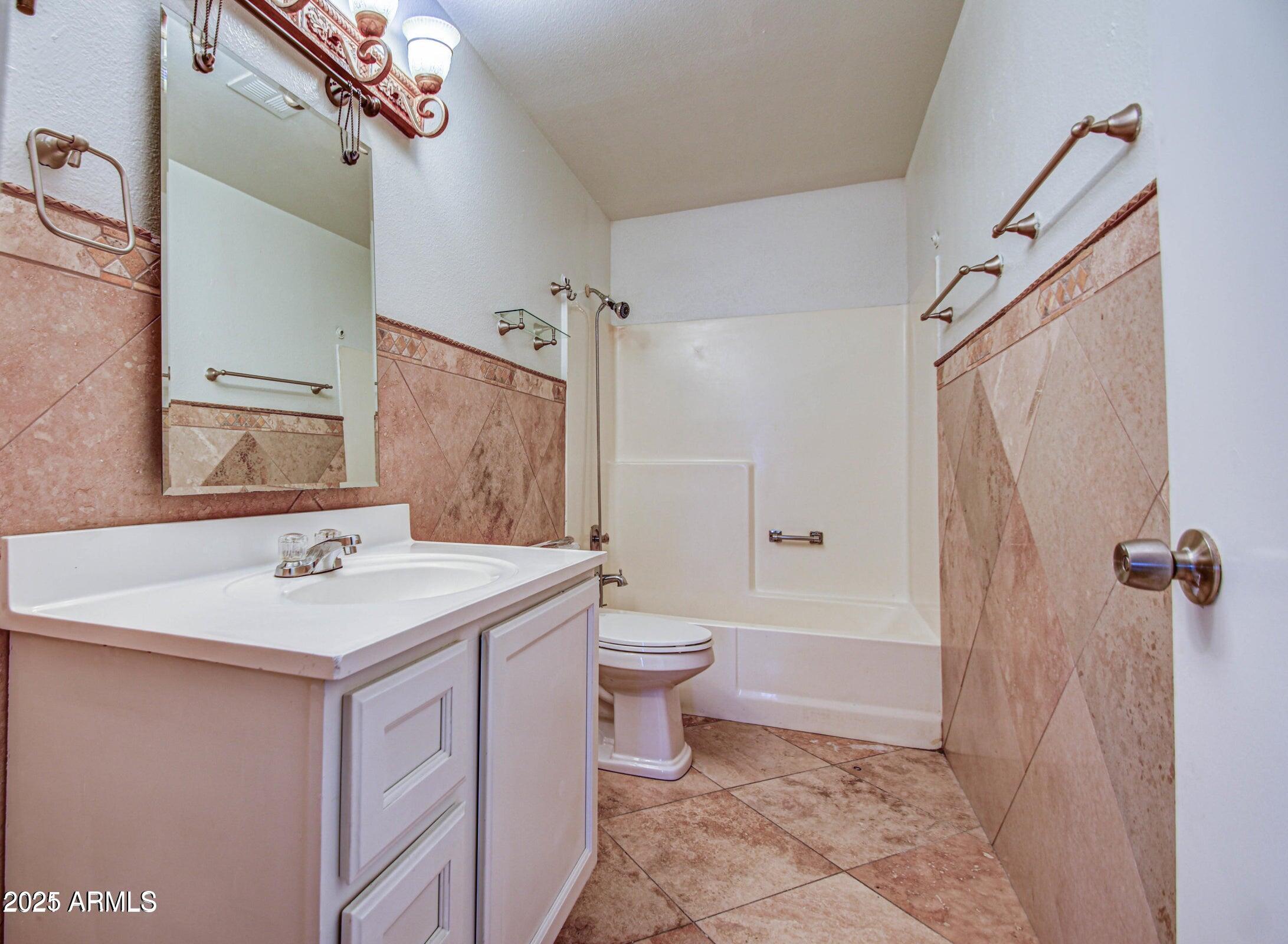17629 North 36th Street Phoenix, AZ 85032 - Photo 12 of 20 a bathroom with a sink toilet and shower