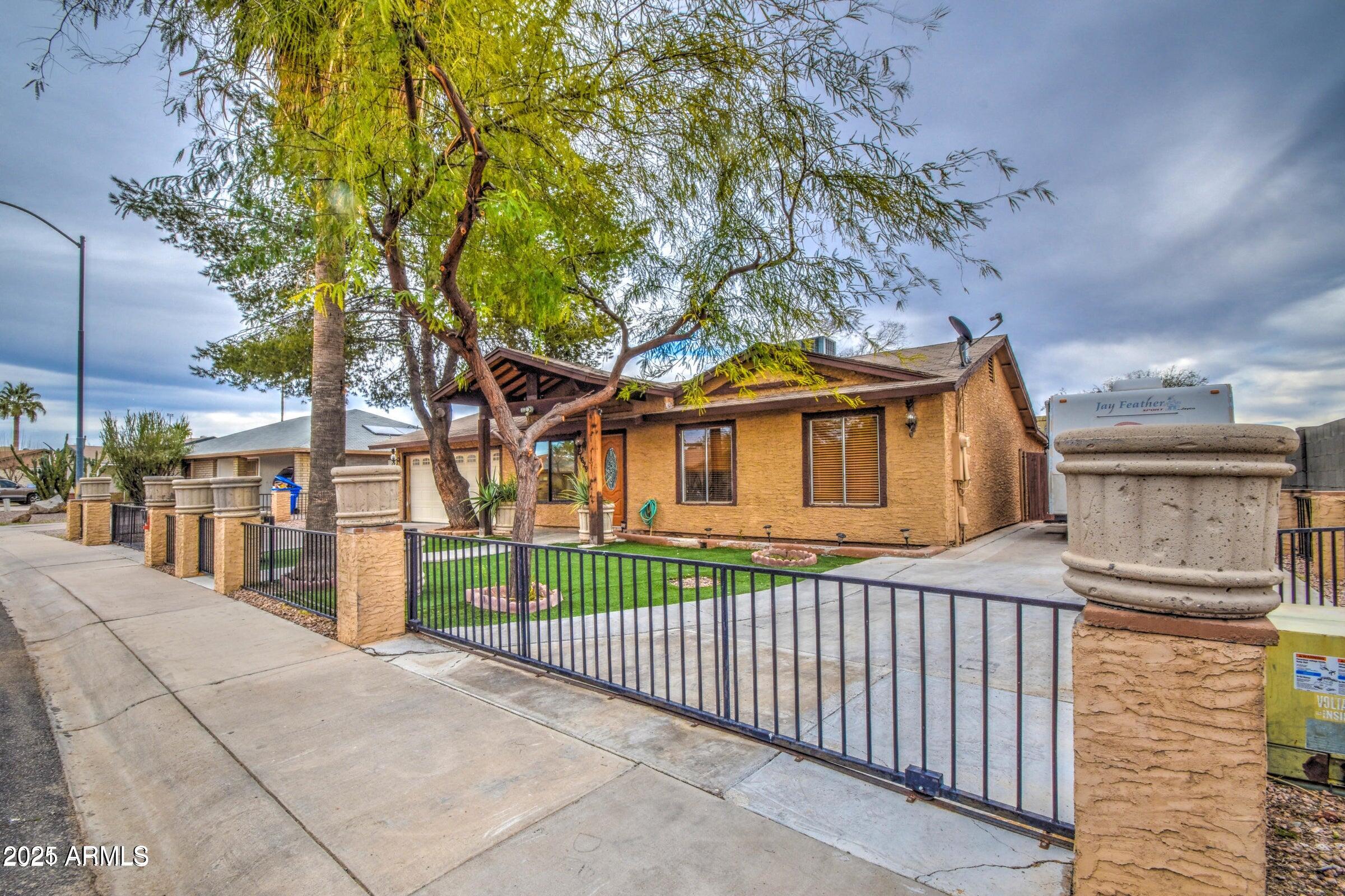 17629 North 36th Street Phoenix, AZ 85032 - Photo 2 of 20 a front view of a house with a porch