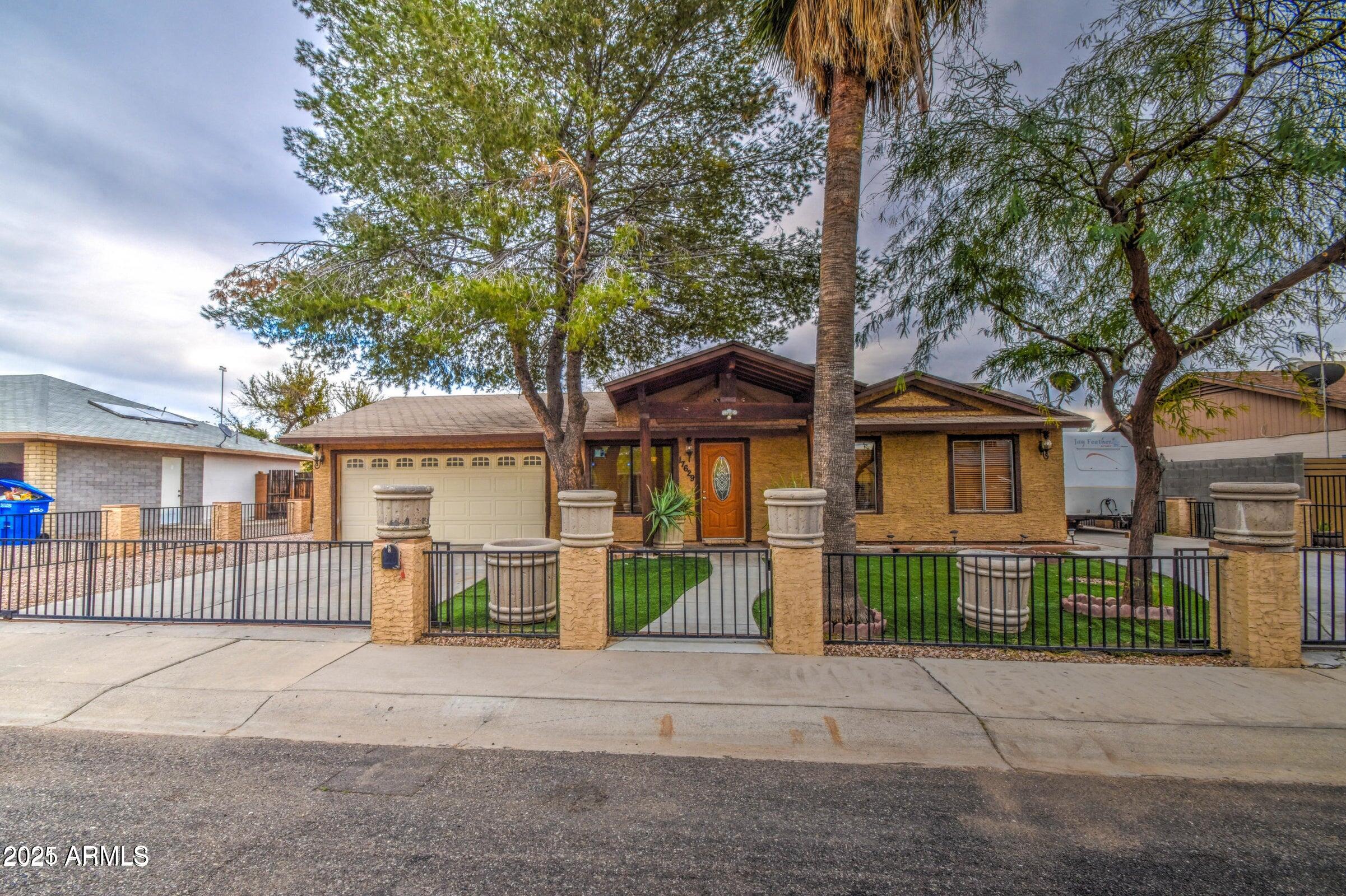 17629 North 36th Street Phoenix, AZ 85032 - Photo 3 of 20 front view of a house with a street view