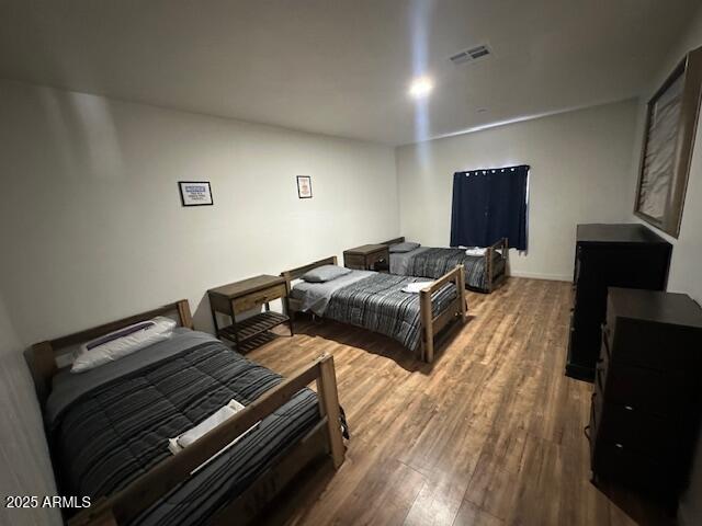 17629 North 36th Street Phoenix, AZ 85032 - Photo 6 of 20 a bedroom with bed and wooden floor