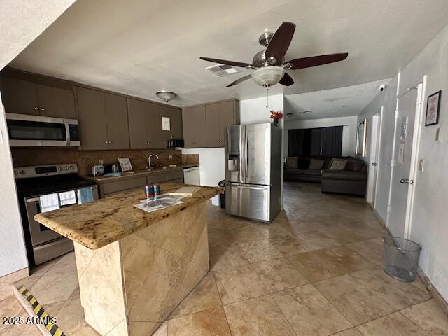 17629 North 36th Street Phoenix, AZ 85032 - Photo 8 of 20 a view of kitchen with refrigerator microwave and cabinets