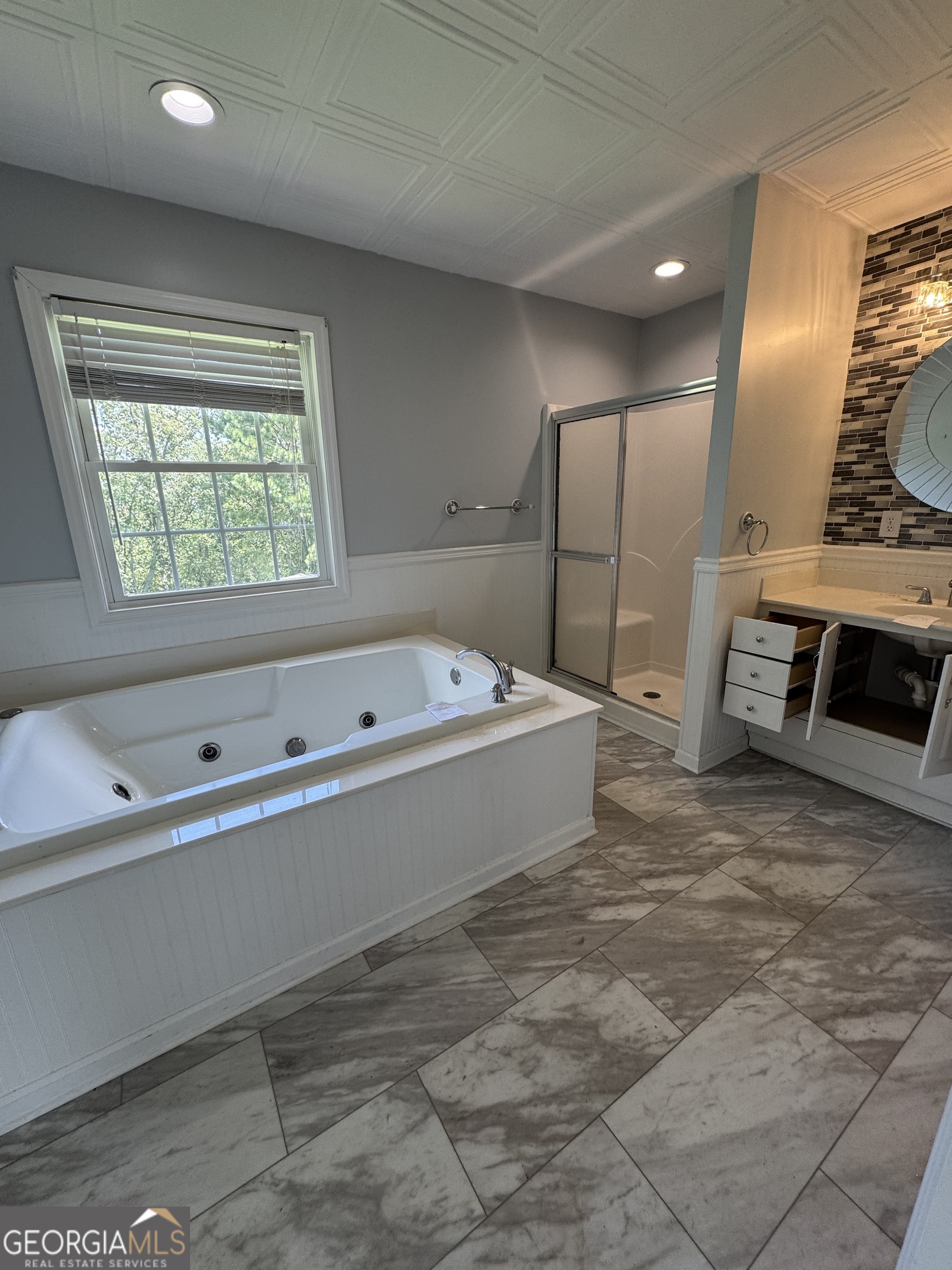 7223 Scenic Heights Road Manchester, GA 31816 - Photo 14 of 23 a bathroom with a bathtub and a sink