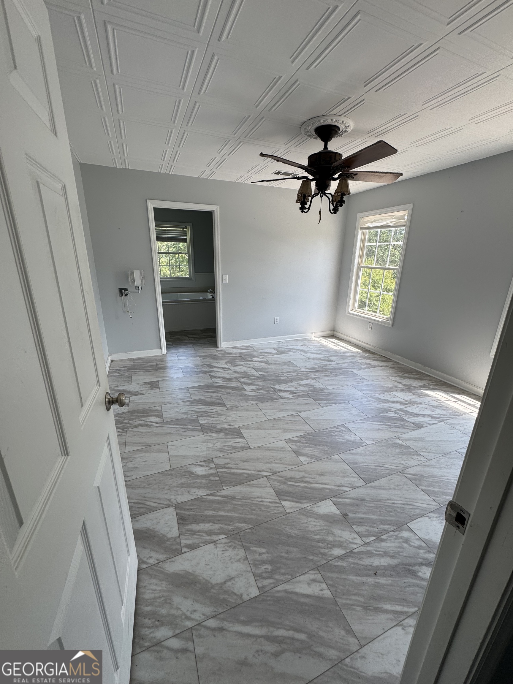 7223 Scenic Heights Road Manchester, GA 31816 - Photo 3 of 23 a view of empty room with a ceiling fan and window