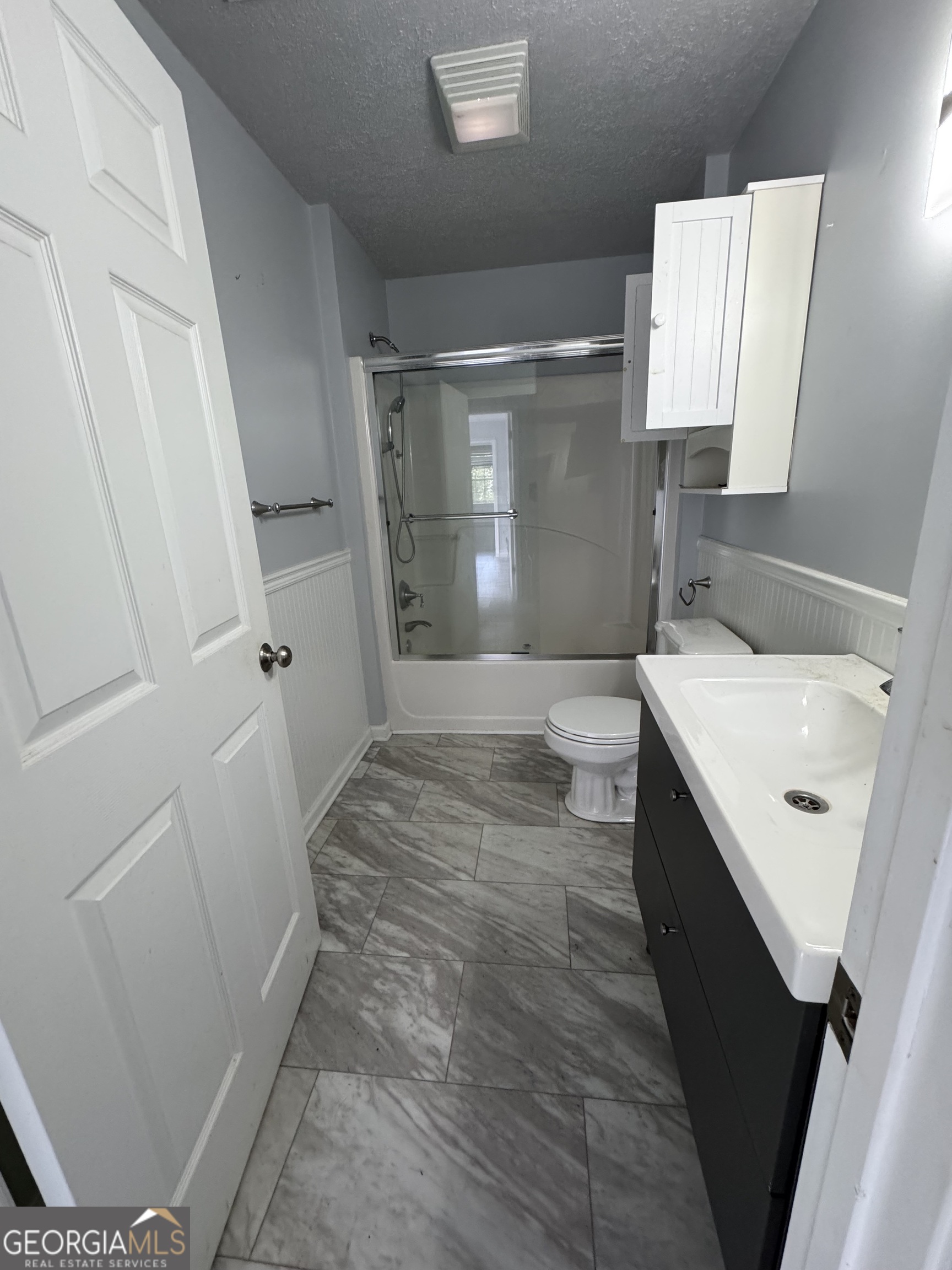 7223 Scenic Heights Road Manchester, GA 31816 - Photo 4 of 23 a bathroom with sink a toilet a window and vanity