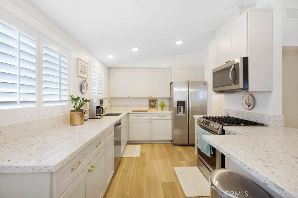 954 Delay Avenue Glendora, CA 91740 - Photo 12 of 35 a kitchen with a sink stove and refrigerator