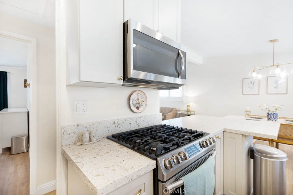 954 Delay Avenue Glendora, CA 91740 - Photo 15 of 35 a kitchen with a stove and a microwave