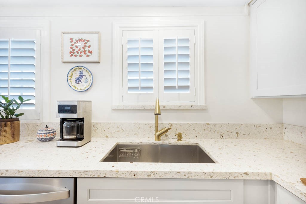 954 Delay Avenue Glendora, CA 91740 - Photo 16 of 35 a kitchen with a sink and a clock