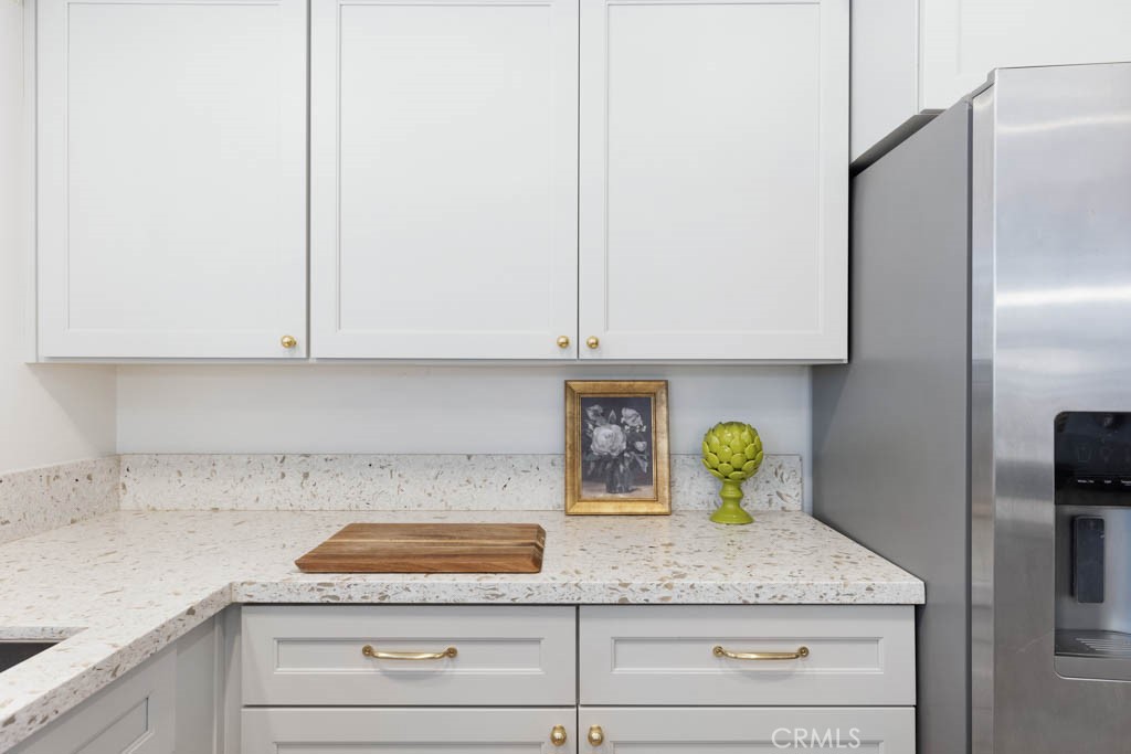 954 Delay Avenue Glendora, CA 91740 - Photo 17 of 35 a kitchen with granite countertop a sink stainless steel appliances and cabinets