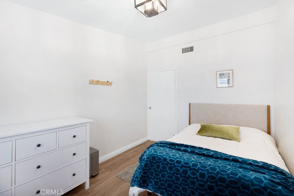 954 Delay Avenue Glendora, CA 91740 - Photo 21 of 35 a bedroom with a bed and a cabinets