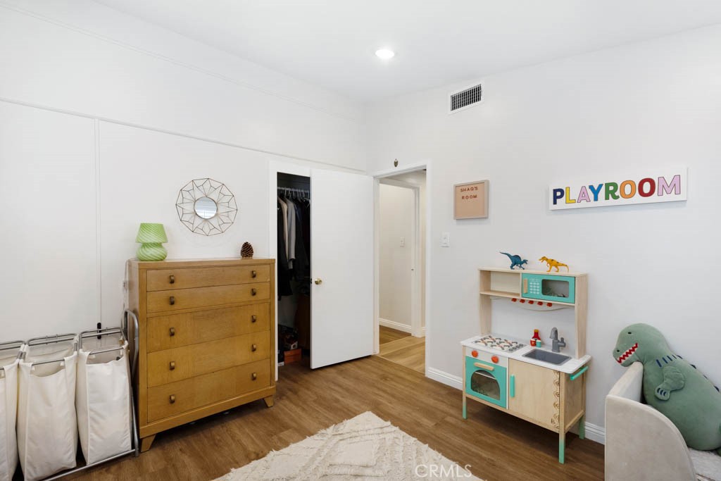 954 Delay Avenue Glendora, CA 91740 - Photo 25 of 35 a view of a bedroom with baby crib and dresser