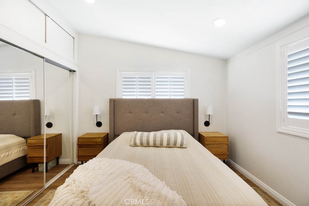 954 Delay Avenue Glendora, CA 91740 - Photo 28 of 35 a bedroom with a bed and wooden floor