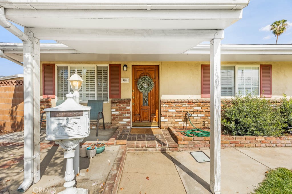 954 Delay Avenue Glendora, CA 91740 - Photo 4 of 35 a view of a living room and balcony with furniture and floor to ceiling window
