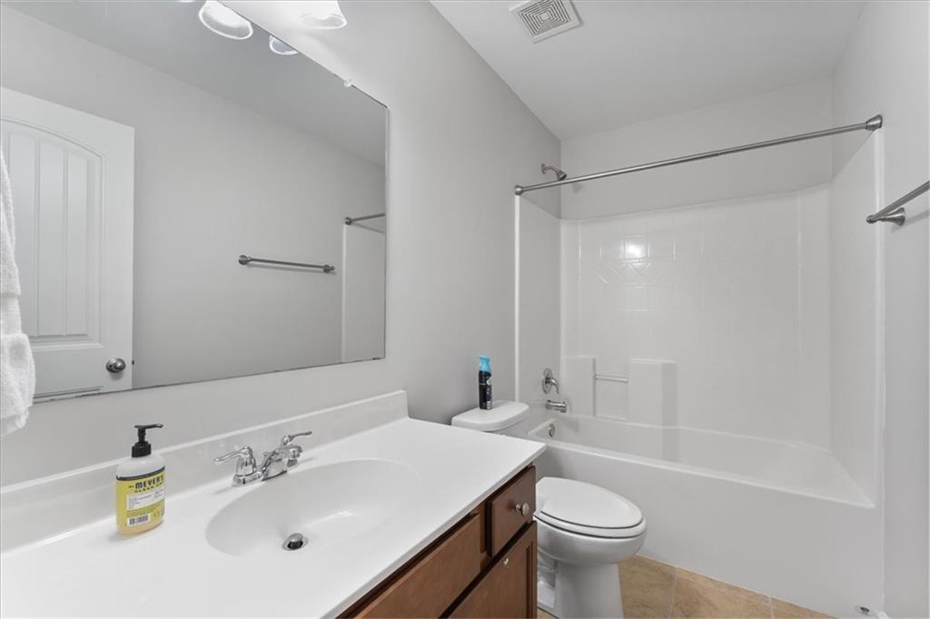 556 Olympic Way Acworth, GA 30102 - Photo 27 of 41 a bathroom with a sink a toilet and shower