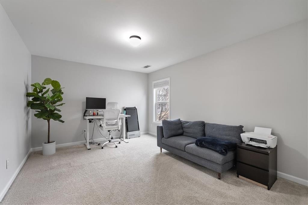 556 Olympic Way Acworth, GA 30102 - Photo 28 of 41 a living room with furniture and a flat screen tv