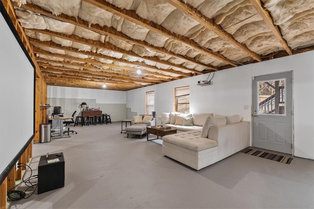 556 Olympic Way Acworth, GA 30102 - Photo 33 of 41 a living room with furniture and a flat screen tv