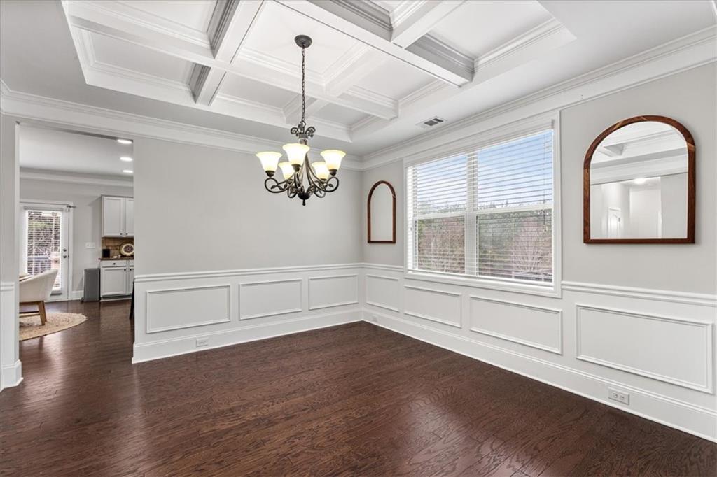556 Olympic Way Acworth, GA 30102 - Photo 6 of 41 wooden floor in an empty room with a window
