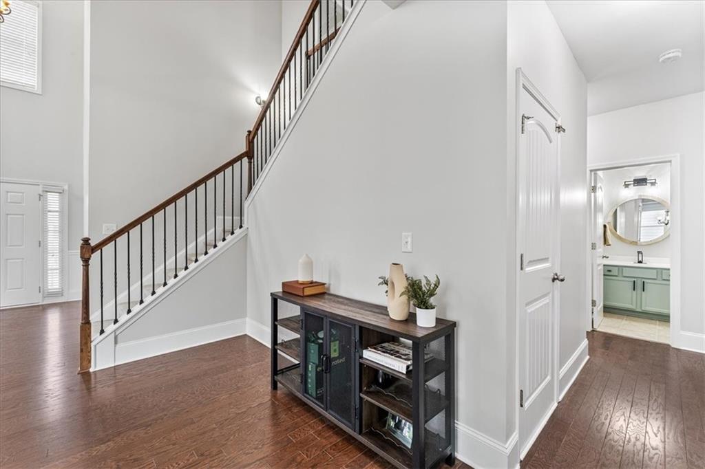 556 Olympic Way Acworth, GA 30102 - Photo 8 of 41 a view of a hallway with wooden floor and furniture