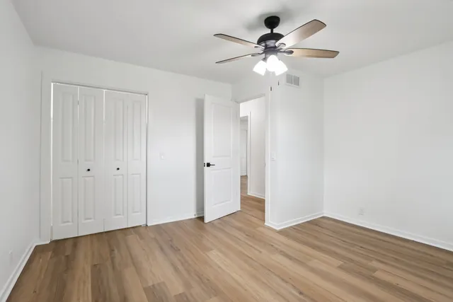 a bathroom with a double vanity sink toilet and mirror