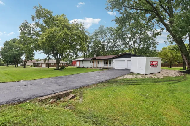 a view of a house with a yard
