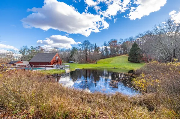 a view of a lake with a building in the background
