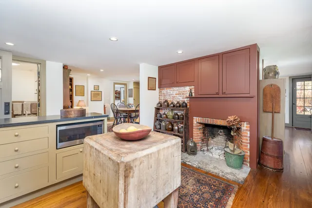 a kitchen with sink a stove and cabinets