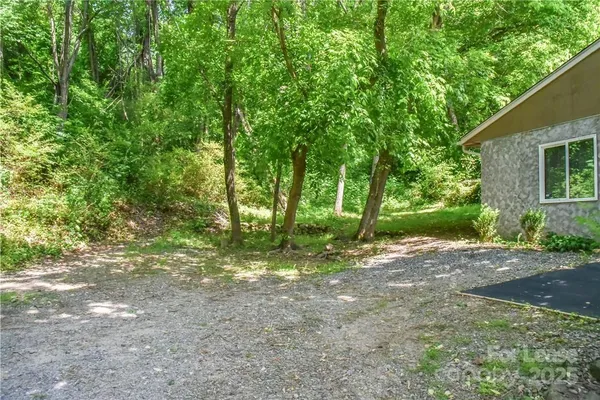 a backyard of a house with lots of green space
