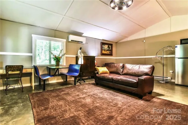 a living room with furniture window and wooden floor
