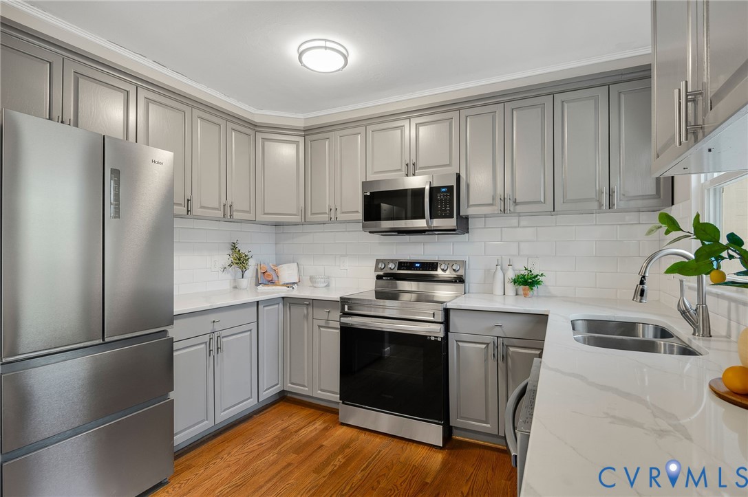 511 Crieff Road Richmond, VA 23225 - Photo 12 of 26 Kitchen featuring gray cabinetry, appliances with