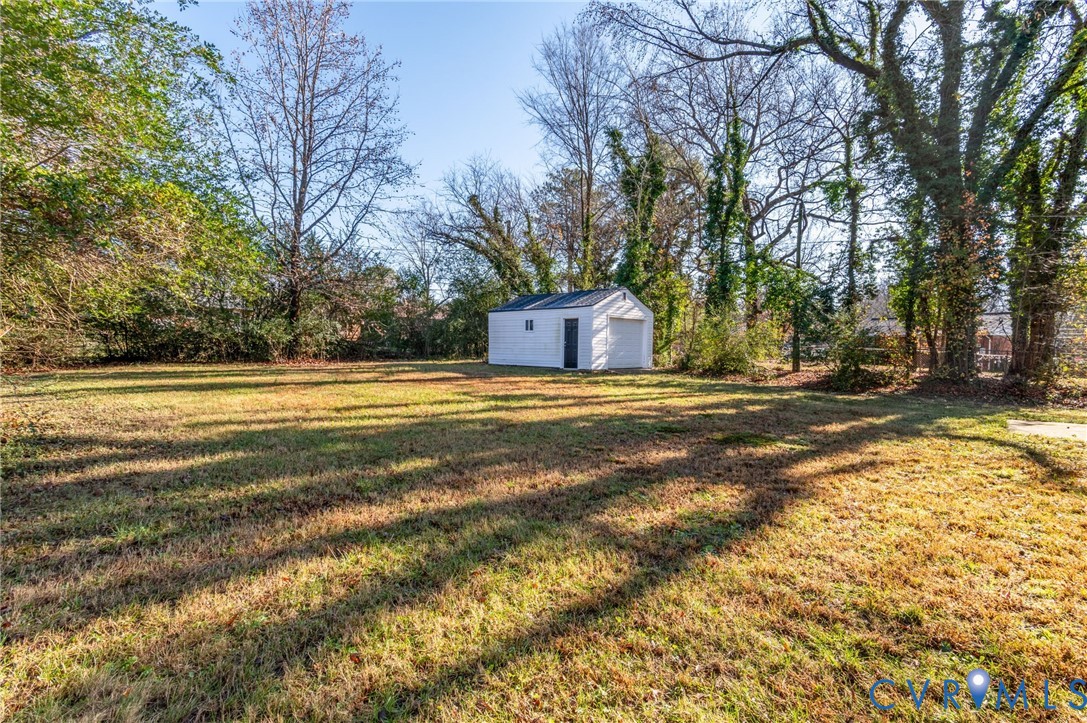 511 Crieff Road Richmond, VA 23225 - Photo 25 of 26 View of green lawn featuring an outdoor structure