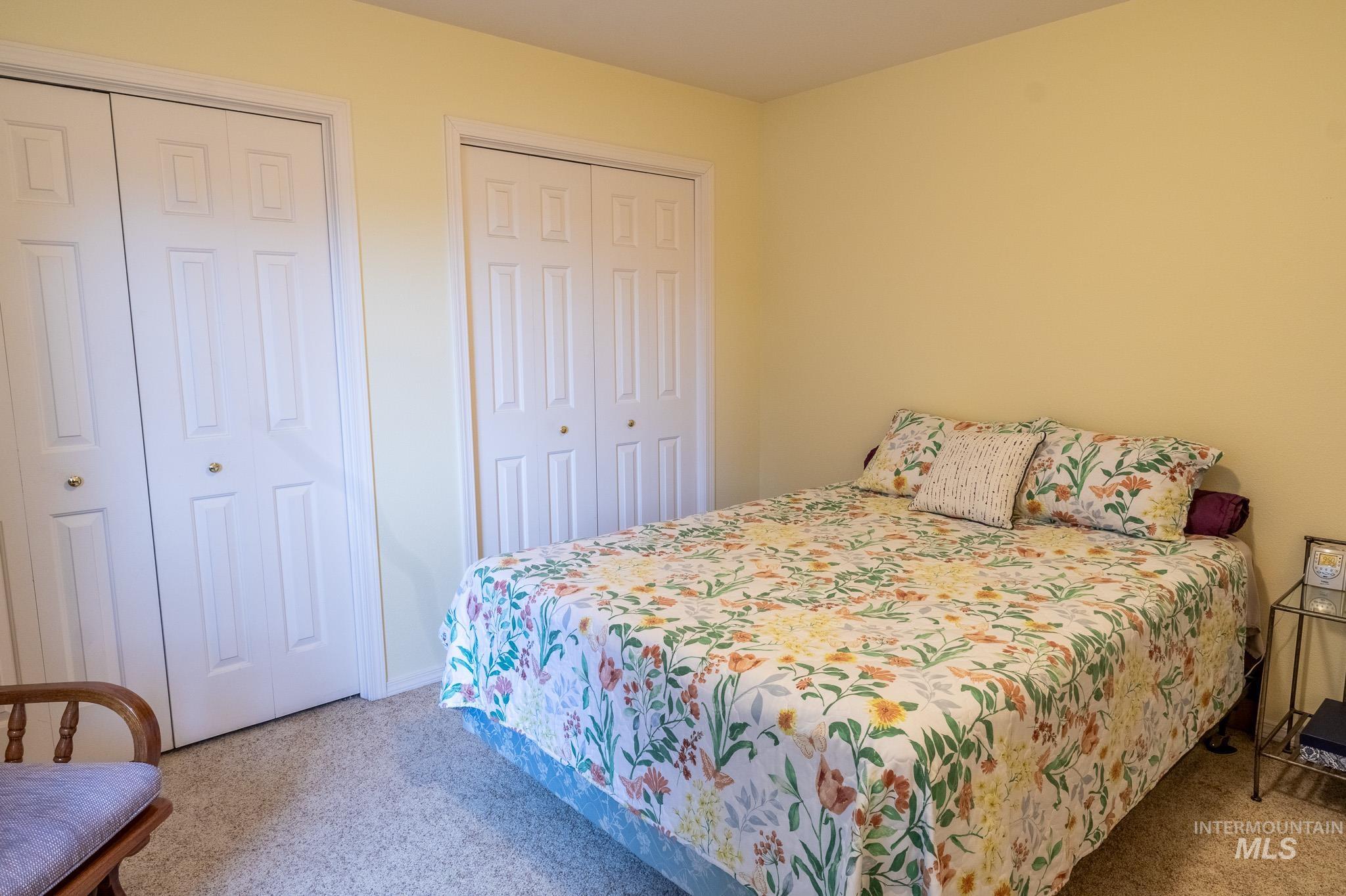925 Hawthorne Street, Unit A Lewiston, ID 83501 - Photo 20 of 25 Bedroom with multiple closets and light carpet