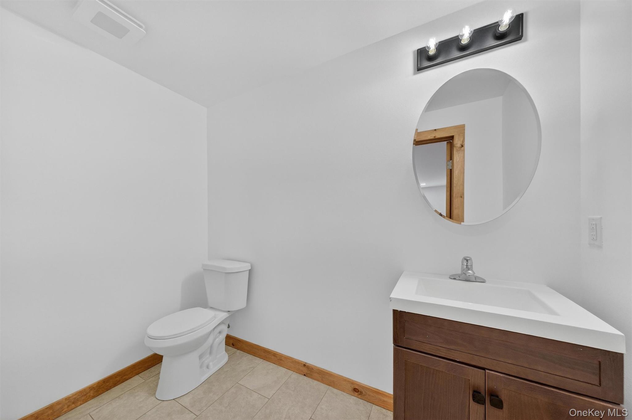 71 Blacks Road Kingston, NY 12401 - Photo 12 of 20 a bathroom with a toilet sink and mirror