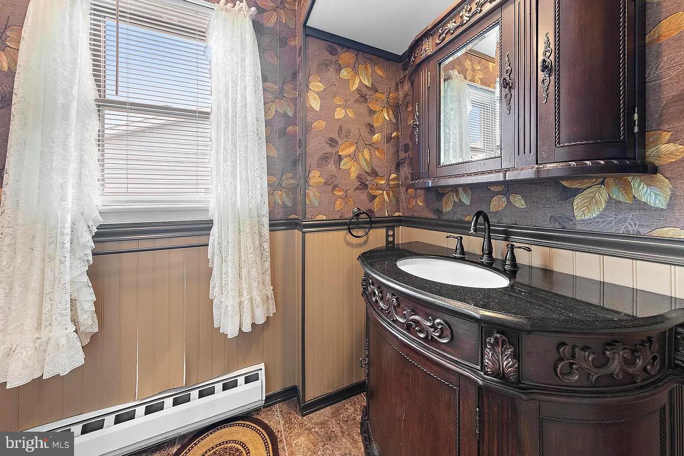 22 Fir Road Manahawkin, NJ 08050 - Photo 24 of 35 a kitchen with a stove and a sink