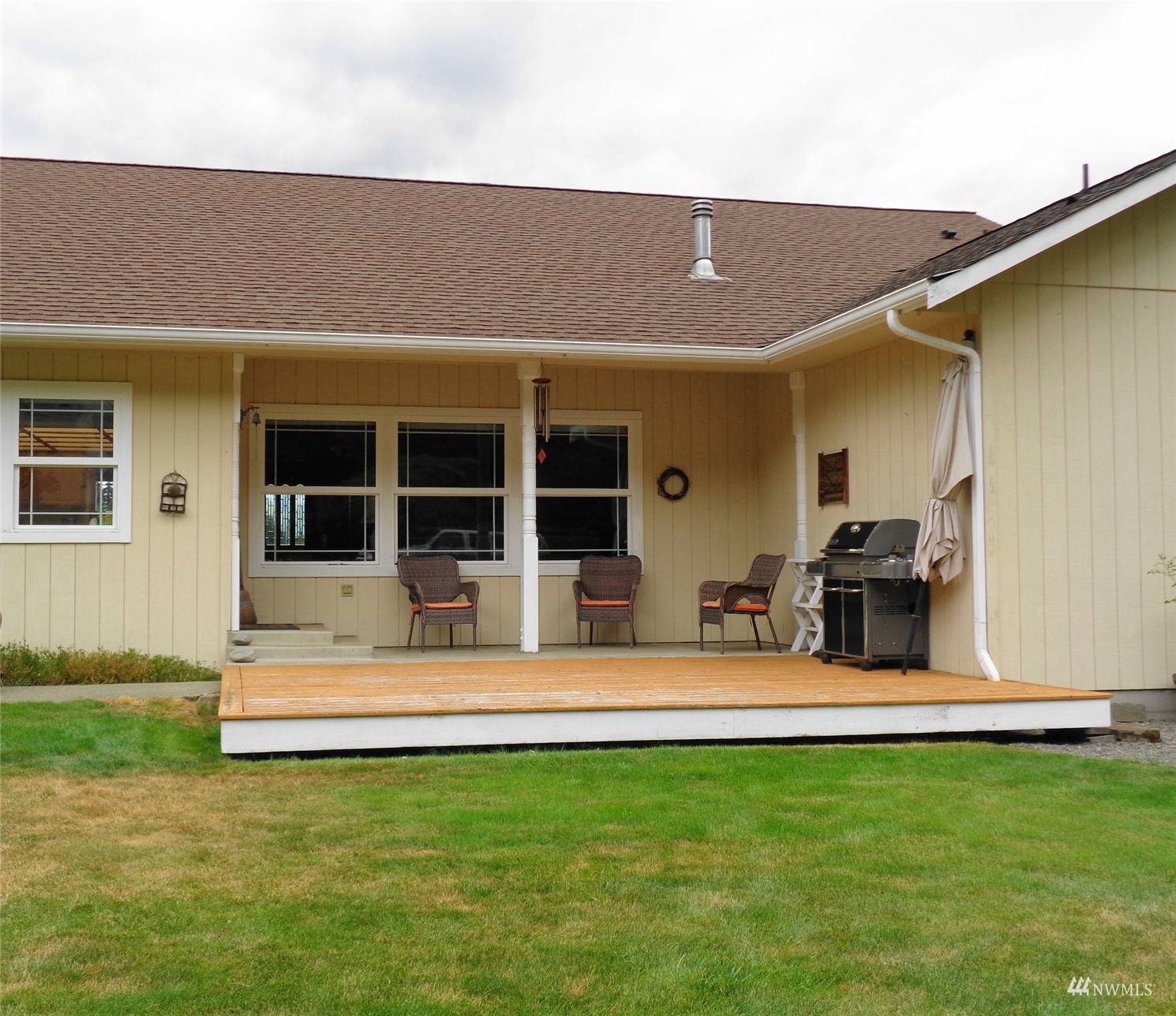 9517 185th Avenue Southwest Rochester, WA 98579 - Photo 3 of 28 a view of a house with a backyard porch and sitting area