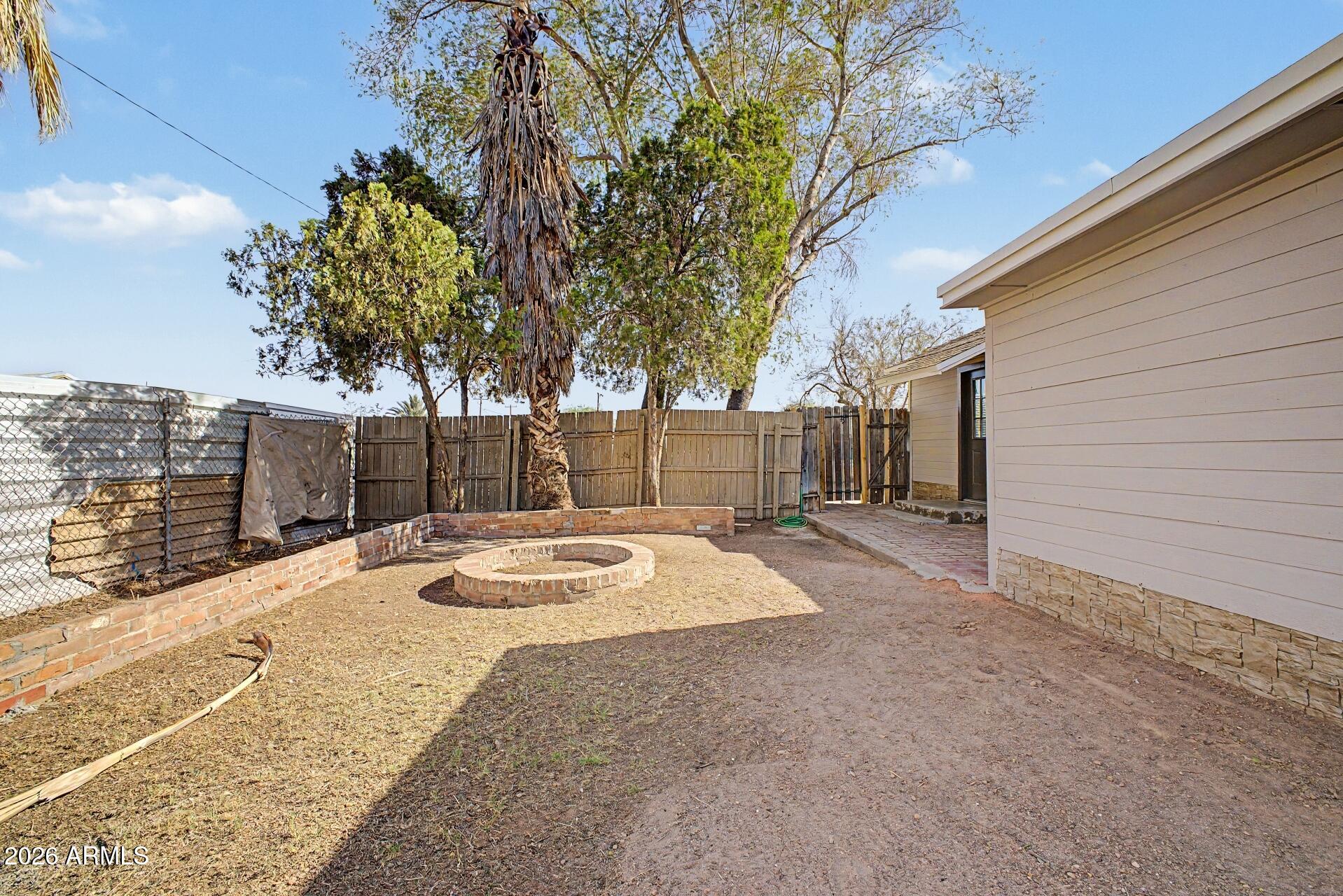 1914 East Monte Vista Road Phoenix, AZ 85006 - Photo 24 of 26 a house with trees in front of it