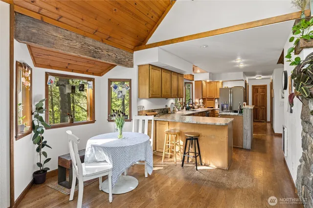 a dining room with furniture and window