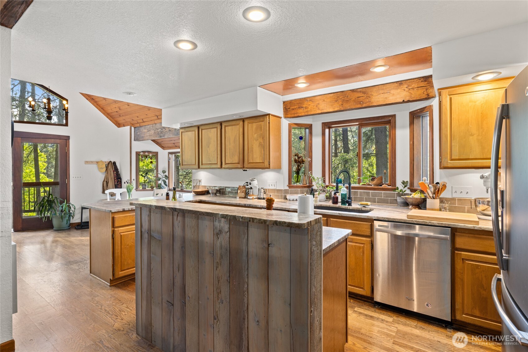4265 Highway 97 Peshastin, WA 98847 - Photo 12 of 38 a kitchen with lots of counter top space and wooden floor