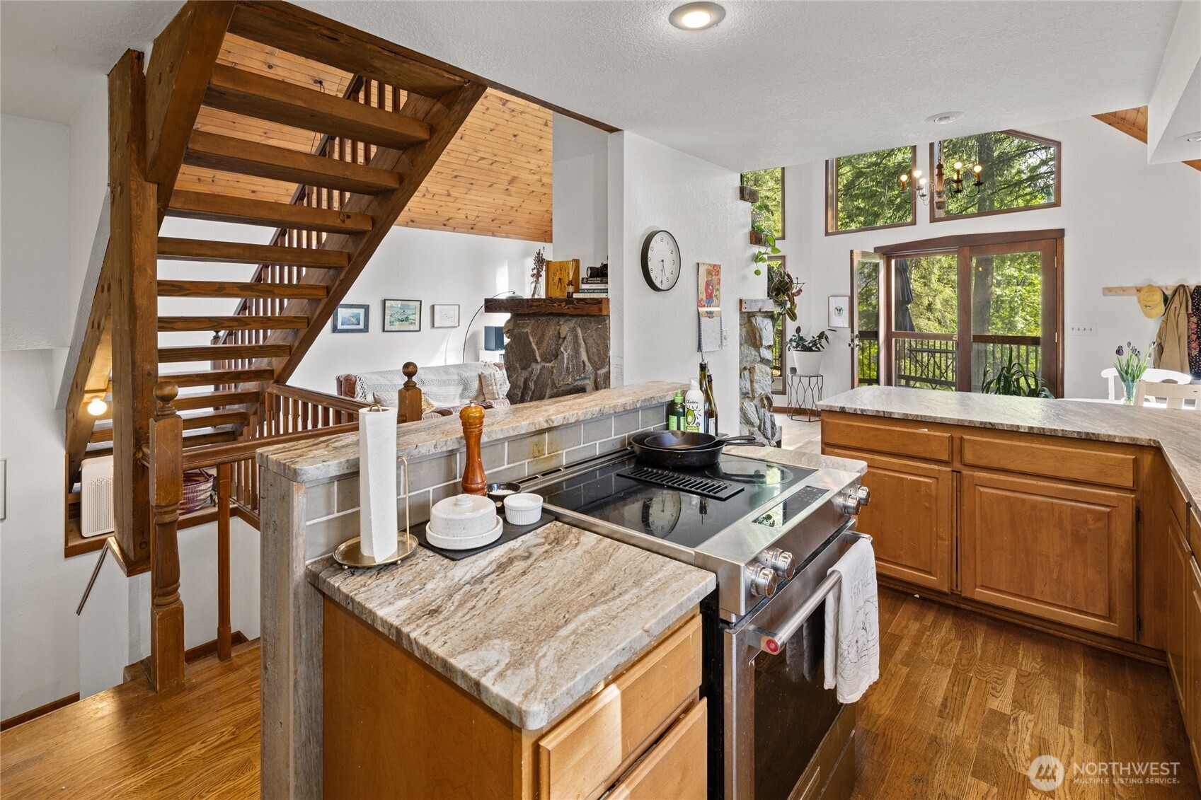 4265 Highway 97 Peshastin, WA 98847 - Photo 15 of 38 a kitchen with furniture a large window and stainless steel appliances